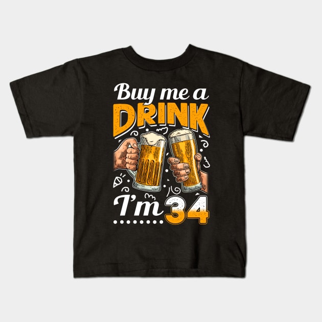 Buy Me A Drink I_m 34 34th Birthday Kids T-Shirt by Elliottda